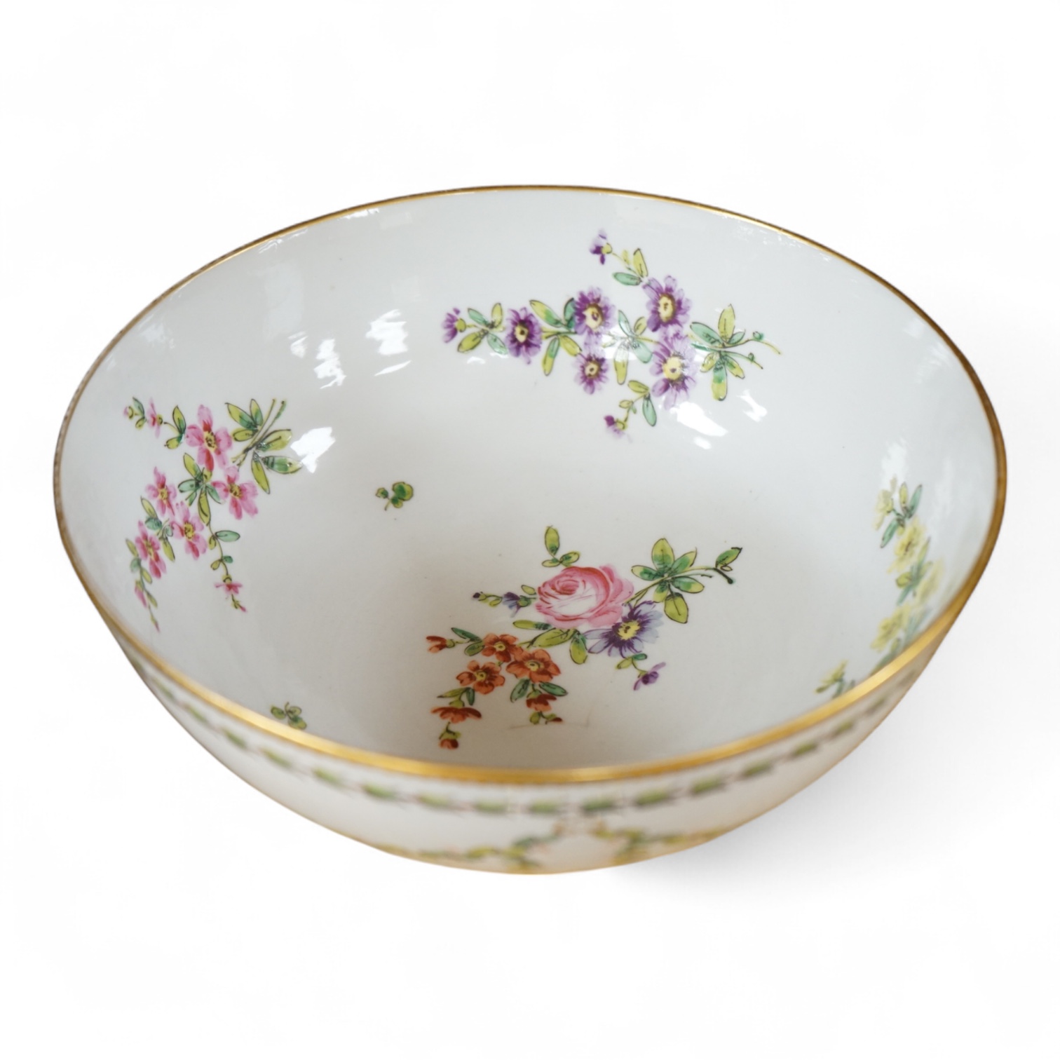 A Continental copy of a Bristol Champions bowl, rose and gilt decorated, 23cm diameter.